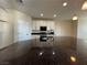 Modern kitchen with dark countertops and white cabinetry at 10273 Aragon Crown Rd, Las Vegas, NV 89135