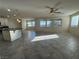 Spacious living room with tile floors, a ceiling fan, and natural light from several windows at 10273 Aragon Crown Rd, Las Vegas, NV 89135