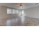 Bright and airy living room with tile flooring, recessed lighting, and multiple windows at 10273 Aragon Crown Rd, Las Vegas, NV 89135