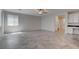 Bright living space with tile floors, recessed lights, leading to kitchen with white cabinets at 10273 Aragon Crown Rd, Las Vegas, NV 89135