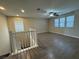 Upstairs loft area with wood-look flooring and ceiling fan at 10273 Aragon Crown Rd, Las Vegas, NV 89135