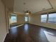 Large main bedroom with wood-look flooring and lots of windows at 10273 Aragon Crown Rd, Las Vegas, NV 89135