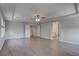 Spacious main bedroom with tray ceiling, ceiling fan, and bright, light filled windows at 10273 Aragon Crown Rd, Las Vegas, NV 89135