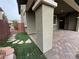 Covered patio with brick flooring and landscaping at 10273 Aragon Crown Rd, Las Vegas, NV 89135