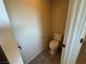 Small powder room with toilet and pedestal sink at 10273 Aragon Crown Rd, Las Vegas, NV 89135