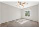 This bedroom offers neutral walls, carpet floors, a ceiling fan, and natural light from the window at 10280 Gilmore Canyon Ct # 203, Las Vegas, NV 89129