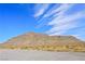 Expansive desert landscape featuring clear blue skies and majestic mountains as a stunning backdrop to the property at 10280 Gilmore Canyon Ct # 203, Las Vegas, NV 89129