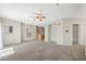 Spacious living room featuring neutral carpet, fresh paint, and natural light at 10280 Gilmore Canyon Ct # 203, Las Vegas, NV 89129