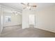 Bright main bedroom with large mirrored closet, ceiling fan, and neutral carpet at 10280 Gilmore Canyon Ct # 203, Las Vegas, NV 89129