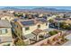 Aerial view of a two-story house with solar panels, a covered patio, and a nice neighborhood view at 10611 Auburn Springs Ave, Las Vegas, NV 89166