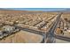 Wide aerial view of a residential area with various houses and roads at 10611 Auburn Springs Ave, Las Vegas, NV 89166