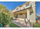 Covered patio with paver stones, landscaped area, and built-in seating at 10611 Auburn Springs Ave, Las Vegas, NV 89166