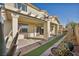 Extended backyard patio with covered pergola and grassy area at 10611 Auburn Springs Ave, Las Vegas, NV 89166