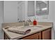 Bathroom features a vanity with granite countertop and a large mirror at 10611 Auburn Springs Ave, Las Vegas, NV 89166