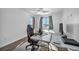 Bedroom with wood floor, window, and gaming setup at 10611 Auburn Springs Ave, Las Vegas, NV 89166