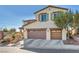 Two-story house with a two-car garage and mature trees at 10611 Auburn Springs Ave, Las Vegas, NV 89166