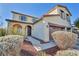 Two-story house with a two-car garage and walkway to entrance at 10611 Auburn Springs Ave, Las Vegas, NV 89166