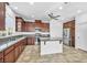 Modern kitchen with granite countertops and dark wood cabinets at 10611 Auburn Springs Ave, Las Vegas, NV 89166