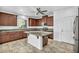 Modern kitchen with granite countertops and dark wood cabinets at 10611 Auburn Springs Ave, Las Vegas, NV 89166