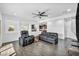 Spacious living room with dark hardwood floors and a ceiling fan at 10611 Auburn Springs Ave, Las Vegas, NV 89166