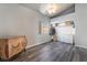 Bright bedroom with wood-look floors and dresser at 1064 Wide Brim Ct, Henderson, NV 89011