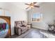 Bright bonus room with wood-look floors and seating at 1064 Wide Brim Ct, Henderson, NV 89011