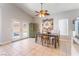 Bright dining room featuring a wooden table, chairs, and access to the backyard at 1064 Wide Brim Ct, Henderson, NV 89011