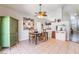 Dining room with a rustic table, green cabinet, and built-in fish tank at 1064 Wide Brim Ct, Henderson, NV 89011