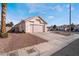 Cute single-story house with pink garage door and gravel landscaping at 1064 Wide Brim Ct, Henderson, NV 89011