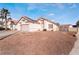 Single-story house with pink garage door and solar panels at 1064 Wide Brim Ct, Henderson, NV 89011