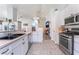 Kitchen with stainless steel appliances, ample counter space, and white cabinets at 1064 Wide Brim Ct, Henderson, NV 89011