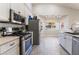 Modern kitchen with stainless steel appliances and a view to the backyard at 1064 Wide Brim Ct, Henderson, NV 89011