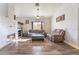 Living room with fireplace, wood floors, and comfy seating at 1064 Wide Brim Ct, Henderson, NV 89011