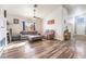 Living room with fireplace, wood floors, and comfy seating at 1064 Wide Brim Ct, Henderson, NV 89011