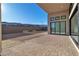 Landscaped backyard with a paved patio area at 10739 Agate Cliffs Ave, Las Vegas, NV 89135