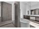 Bathroom featuring a modern soaking tub and a glass walk-in shower at 10739 Agate Cliffs Ave, Las Vegas, NV 89135