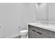 Modern bathroom with gray tile shower and white vanity at 10739 Agate Cliffs Ave, Las Vegas, NV 89135