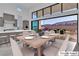 Kitchen dining area with backyard view, virtually staged at 10739 Agate Cliffs Ave, Las Vegas, NV 89135