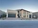 Contemporary home with three-car garage and neutral color scheme at 10739 Agate Cliffs Ave, Las Vegas, NV 89135