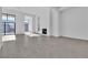 Bright living room featuring modern tile flooring, high ceilings, and expansive windows, perfect for entertaining at 10739 Agate Cliffs Ave, Las Vegas, NV 89135