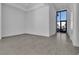 Living room featuring tile floors, recessed lighting, and a large window with natural light at 10739 Agate Cliffs Ave, Las Vegas, NV 89135