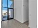 Modern living room with tile flooring and a large glass door to the backyard at 10739 Agate Cliffs Ave, Las Vegas, NV 89135