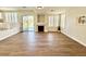 Bright living room featuring hardwood floors and a cozy fireplace at 109 Lakewood Garden Dr, Las Vegas, NV 89148