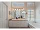 Bathroom with double vanity and soaking tub at 1105 Thornfield Ln, Las Vegas, NV 89123