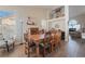 Open concept dining room with seating for eight, offering views into the living room at 1105 Thornfield Ln, Las Vegas, NV 89123