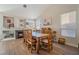 Rustic wooden dining table with seating for eight in a bright, spacious dining room at 1105 Thornfield Ln, Las Vegas, NV 89123