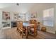 Rustic wooden dining table with seating for eight in a bright, spacious dining room at 1105 Thornfield Ln, Las Vegas, NV 89123