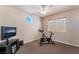 Home exercise room with stationary bike and TV at 1105 Thornfield Ln, Las Vegas, NV 89123