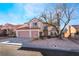 Two-story house with three-car garage and mature tree at 1105 Thornfield Ln, Las Vegas, NV 89123