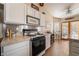 Bright kitchen with stainless steel appliances and breakfast bar at 1105 Thornfield Ln, Las Vegas, NV 89123